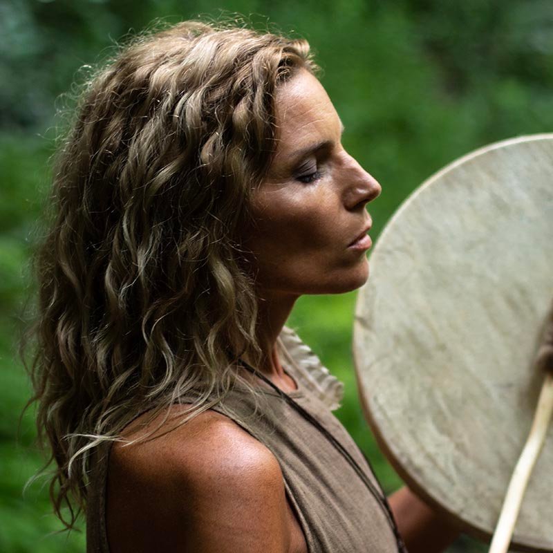 Woman drumming to get back into nature