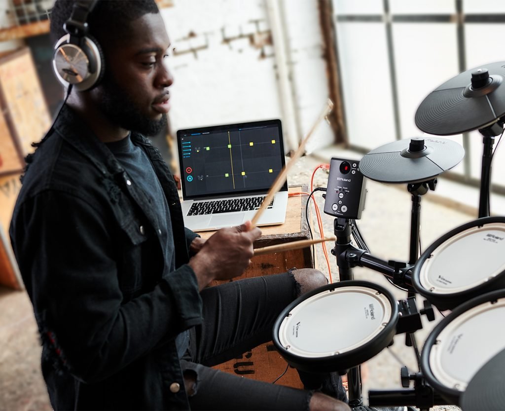 Man playing drums in house